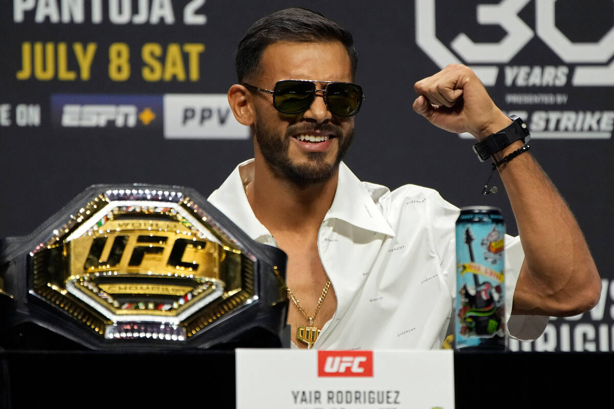 Yair Rodriguez motions during a news conference for the UFC 290 Mixed Martial arts event Thursd ...