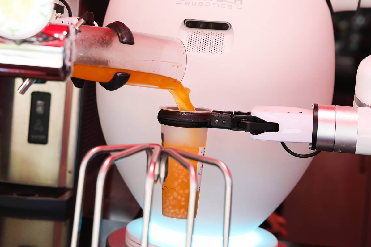 Adam the robot prepares a customer’s boba tea at Cloutea, the first boba tea store run b ...