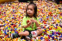 Ryo Pornillosa, 2, plays in a giant pit full of LEGO bricks at the Brick Fest Live LEGO convent ...