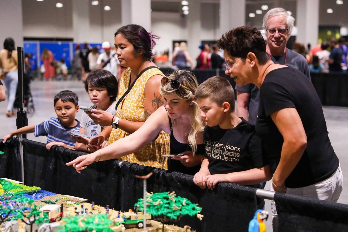 Attendees to the Brick Fest Live LEGO convention look in wonder at the many LEGO creations on d ...