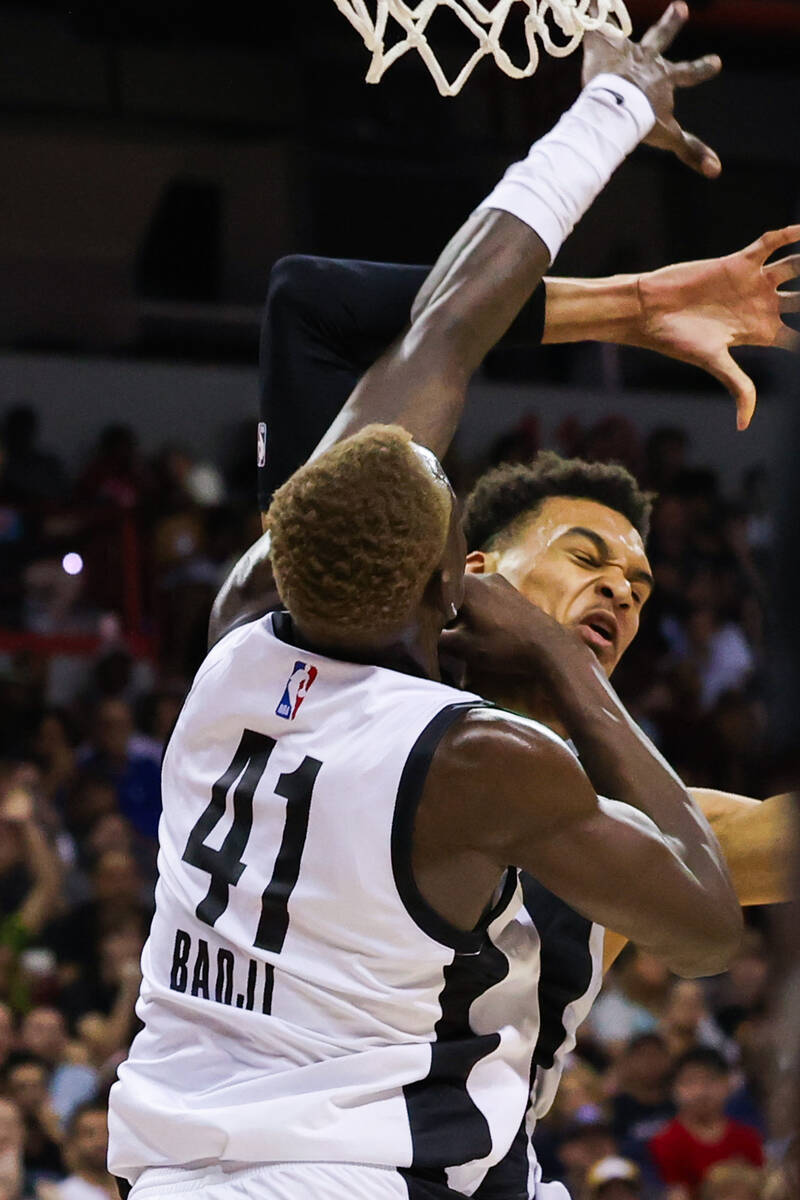 Portland Trailblazers center Ibou Badji (41) fouls San Antonio Spurs forward Victor Wembanyama ...