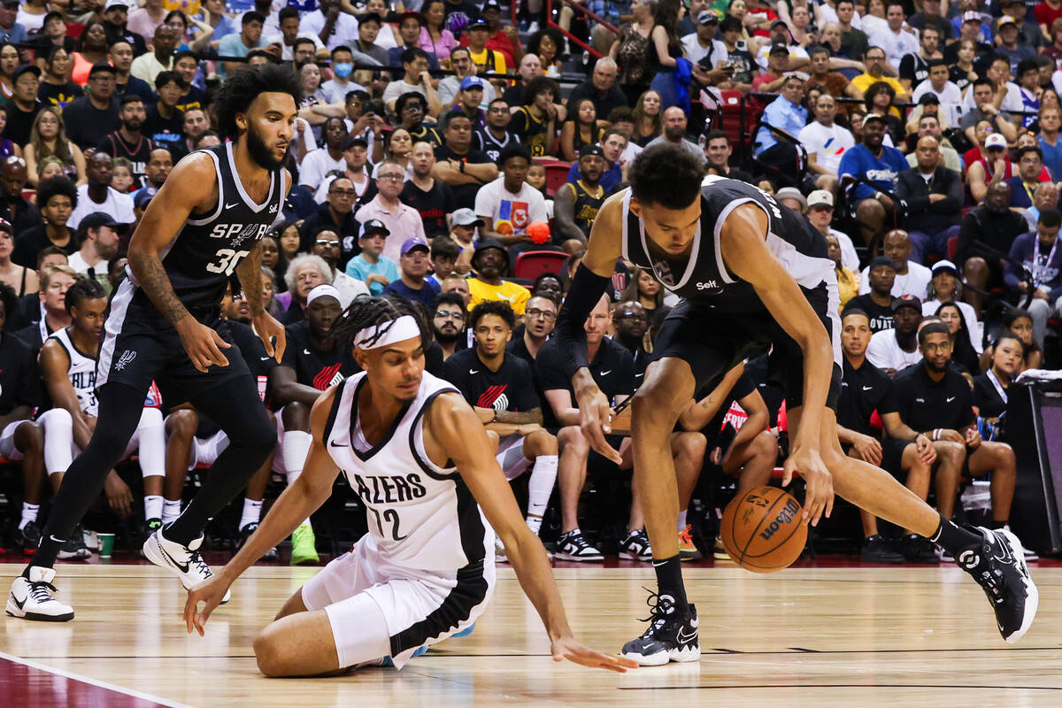 San Antonio Spurs forward Victor Wembanyama (1) steals the ball from Portland Trailblazers guar ...