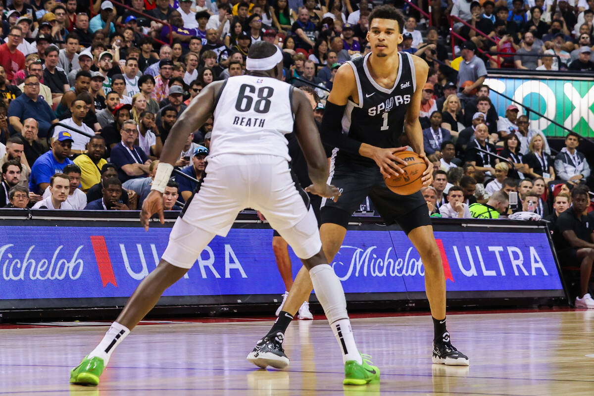San Antonio Spurs forward Victor Wembanyama (1) looks to pass the ball during an NBA Summer Lea ...