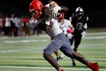 Arbor View’s David Washington (18) catches the pass and runs into the end zone for a tou ...