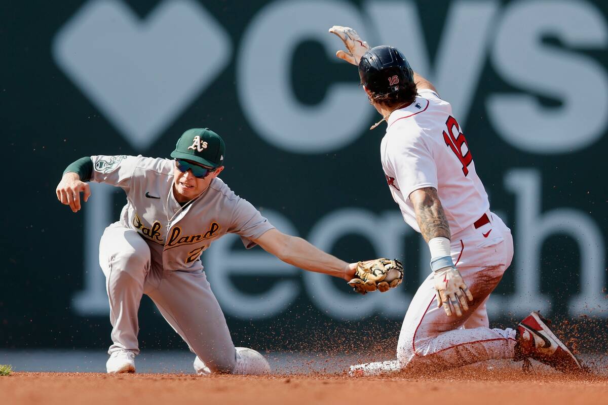 Boston Red Sox's Jarren Duran (16) steals second base against Oakland Athletics' Nick Allen (2) ...