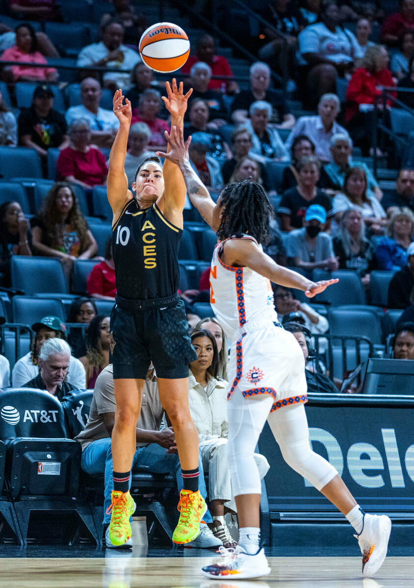 Las Vegas Aces guard Kelsey Plum (10) releases another 3-point basket as Connecticut Sun guard ...