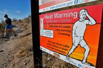 A hiker finishes her hike early to beat high temperatures, Monday, July 10, 2023 in Phoenix. (A ...