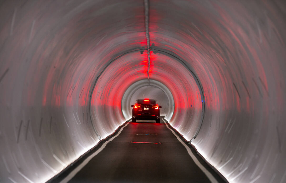 A Tesla is navigated from the West Hall to Central Hall at the Las Vegas Convention Center in J ...