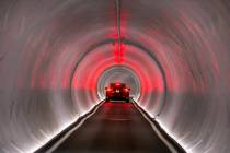 A Tesla is navigated from the West Hall to Central Hall at the Las Vegas Convention Center in J ...