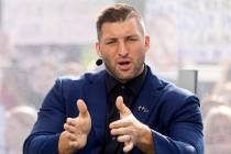 FILE - SEC Nation host Tim Tebow talks to his co-hosts during the SEC Nation broadcast in Lexin ...