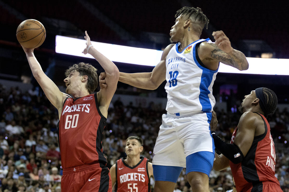 Houston Rockets forward Matthew Mayer (60) snags the ball after Oklahoma City Thunder forward K ...