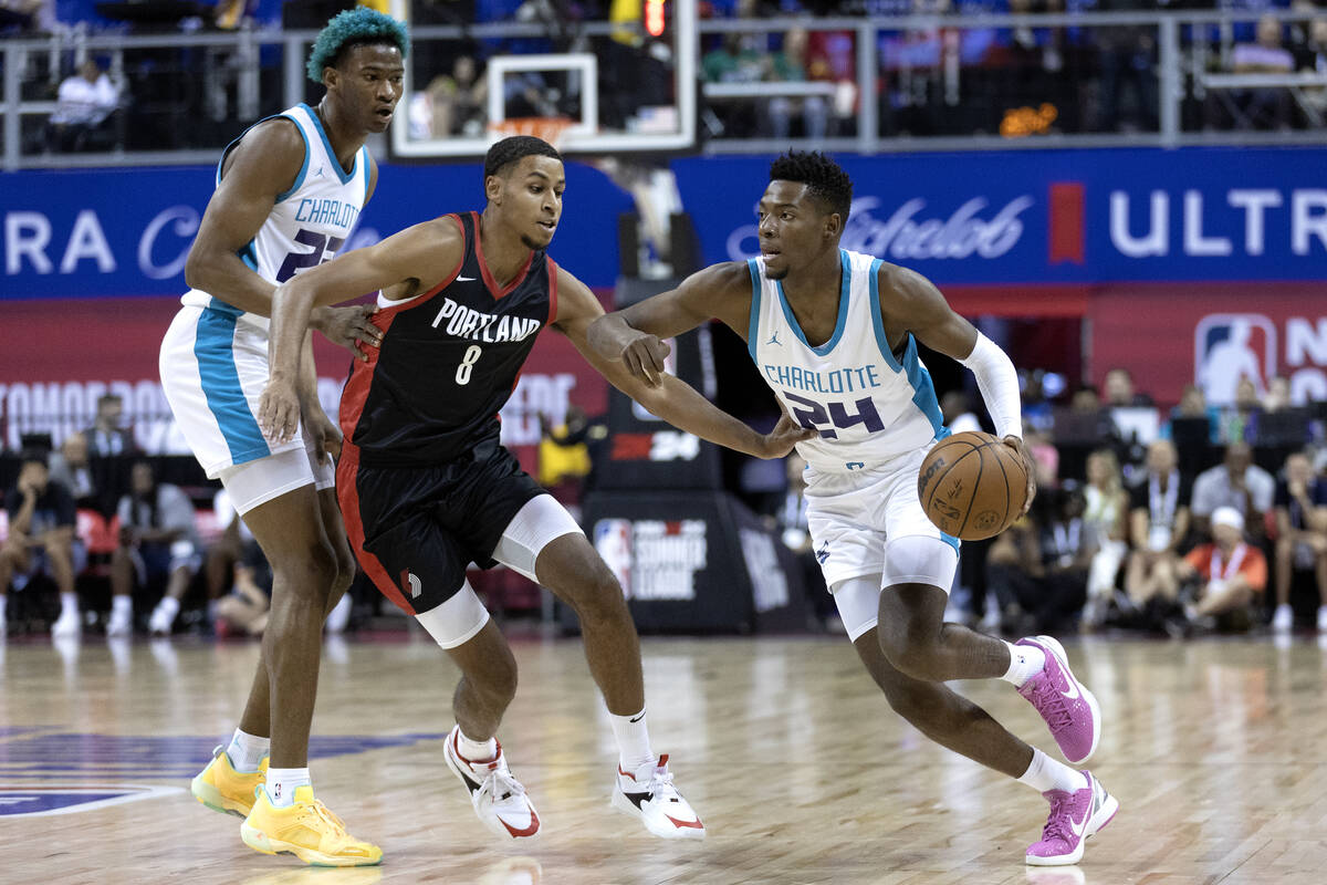 Charlotte Hornets forward Brandon Miller (24) dribbles up the court against Portland Trailblaze ...