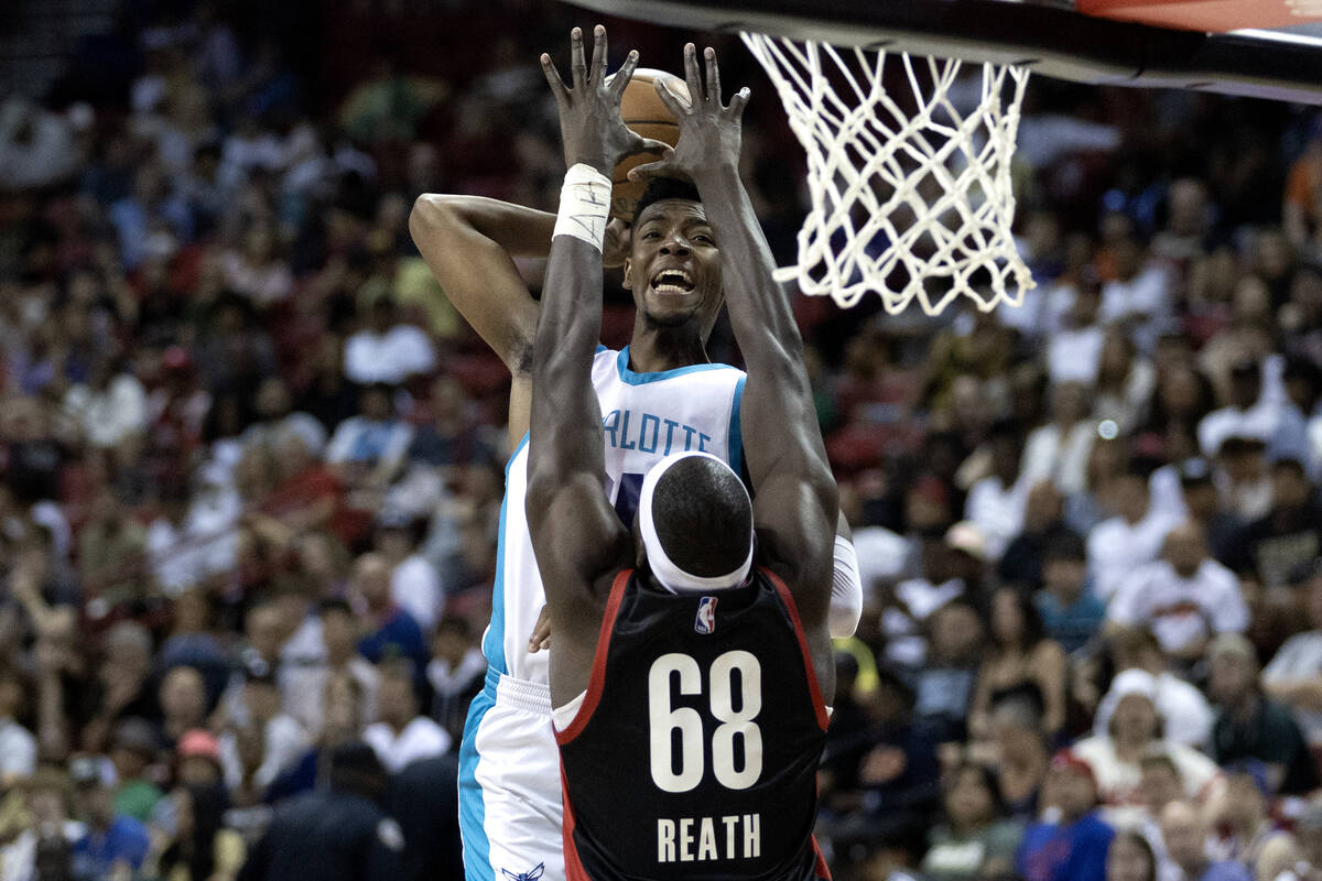 Charlotte Hornets forward Brandon Miller shoots against Portland Trailblazers center Duop Reath ...