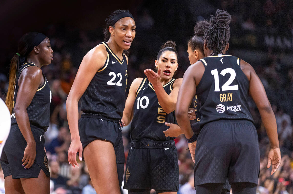 The Aces come together for a quick chat against the Phoenix Mercury during the first half of th ...