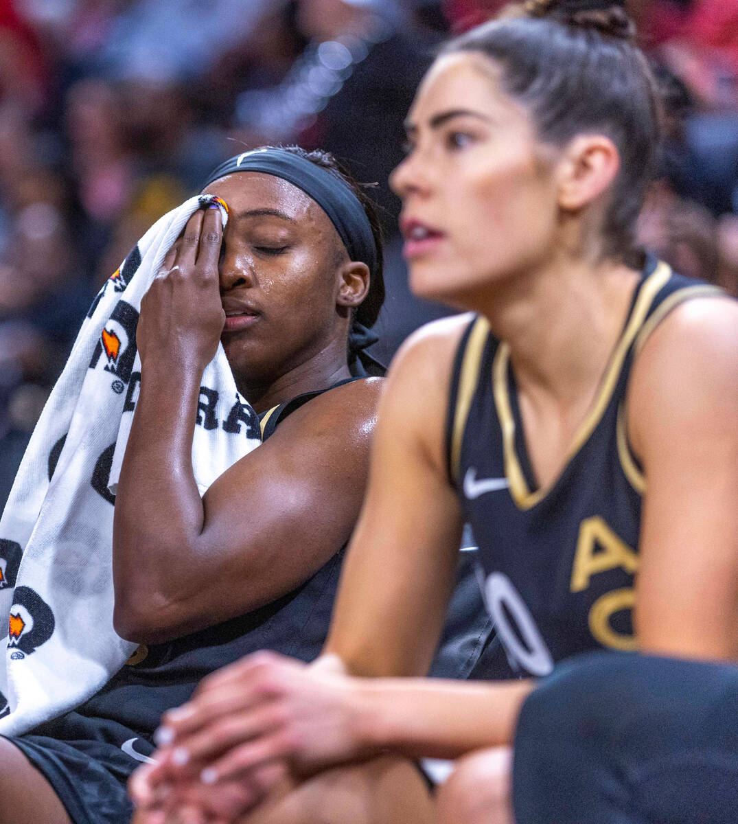 Aces guard Jackie Young (0) is a bit spent on the bench while battling the Phoenix Mercury duri ...