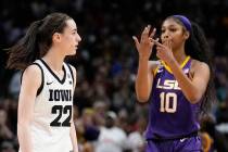 LSU's Angel Reese reacts in front of Iowa's Caitlin Clark during the second half of the NCAA Wo ...