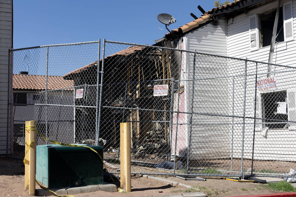 Fire-damaged units are fenced off at the Tides on Charleston on Wednesday, July 19, 2023, in La ...
