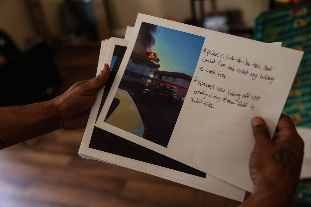 Jeremy Williams shows the Review-Journal photos he took of the aftermath of the Tides apartment ...
