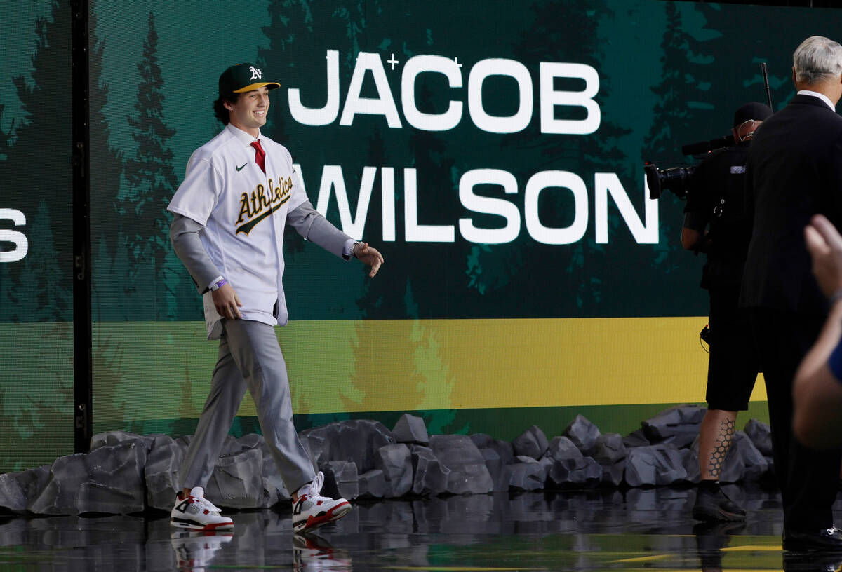 Jacob Wilson walks to the stage as the pick by the Oakland Athletics in baseball's amateur draf ...