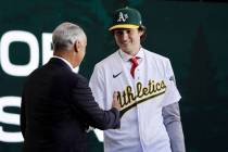 Jacob Wilson walks to the stage to shake hands with Commissioner Rob Manfred, as the pick by th ...