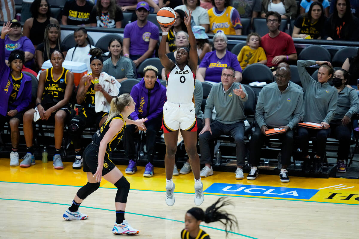 Las Vegas Aces guard Jackie Young (0) shoots against Los Angeles Sparks guard KarlieSamuelson ( ...