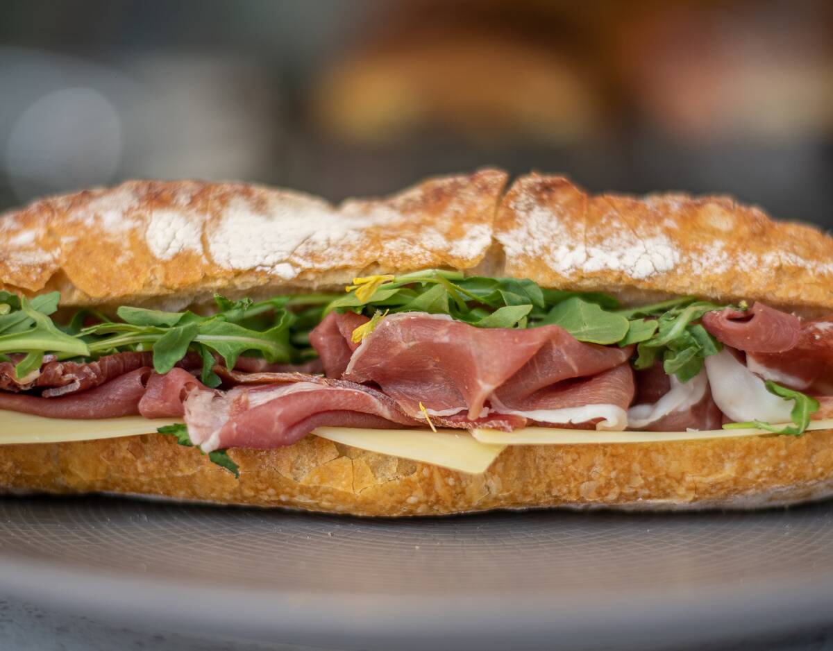 A prosciutto and provolone sandwich on rosemary focaccia from the lunch menu at 1228 Main, open ...