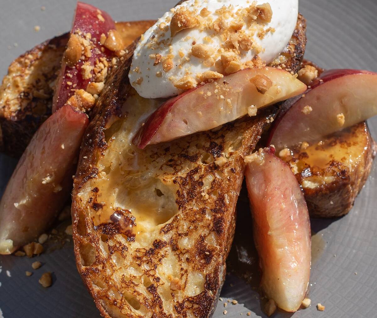 Peaches and cream French toast with crème Chantilly from the breakfast menu at 1228 Main, open ...