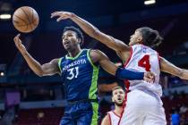 Minnesota Timberwolves guard Brandon Williams (31) works to maintain control of the ball as Atl ...