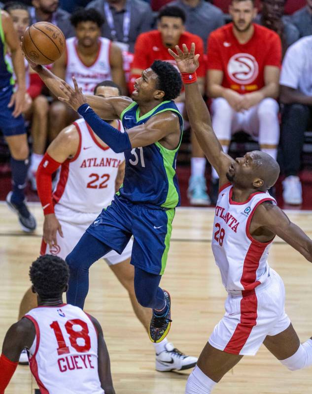 Minnesota Timberwolves guard Brandon Williams (31) elevates to score over Atlanta Hawks forward ...
