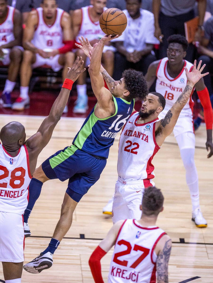 Minnesota Timberwolves guard D.J. Carton (16) elevates to score over Atlanta Hawks forward Mfio ...