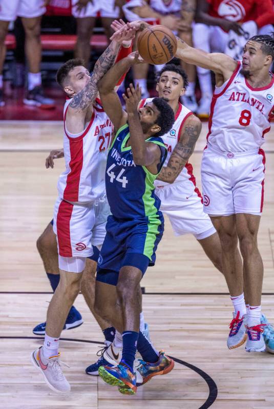 Minnesota Timberwolves forward Feron Hunt (44) has a shot rejected by Atlanta Hawks forward Vit ...