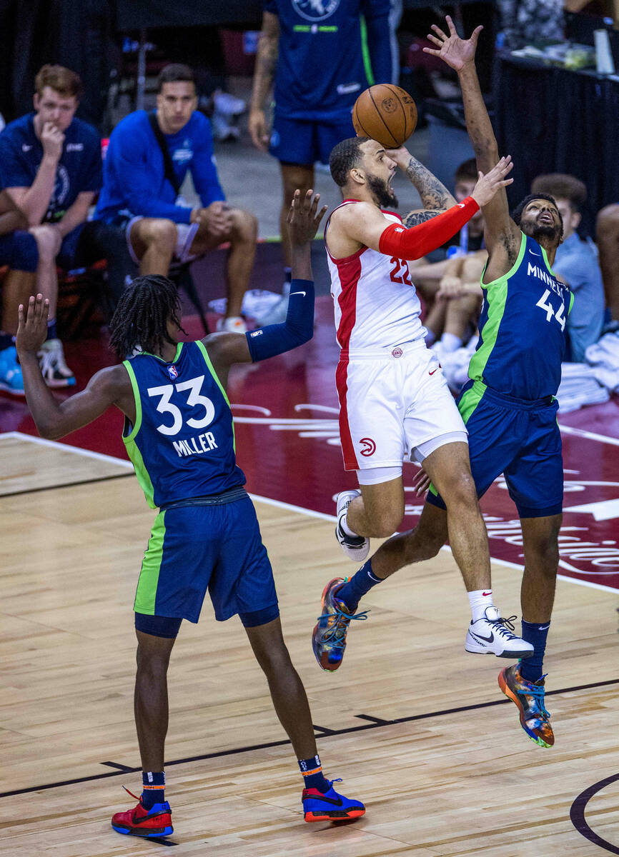 Atlanta Hawks guard Tyrese Martin (22) elevates to score against Minnesota Timberwolves forward ...