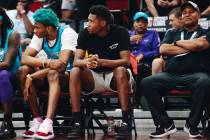 Charlotte Hornets forward Brandon Miller sits on the bench in his street clothes during an NBA ...