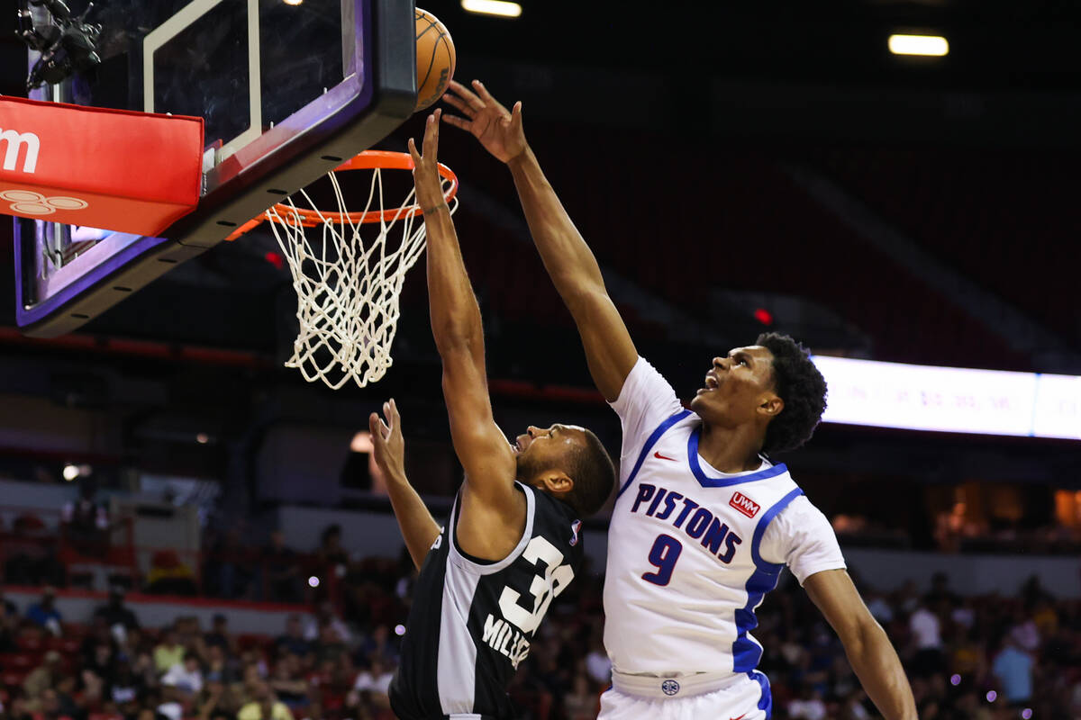 San Antonio Spurs guard/forward Seth Millner (36) goes in for a layup as Detroit Pistons guard ...