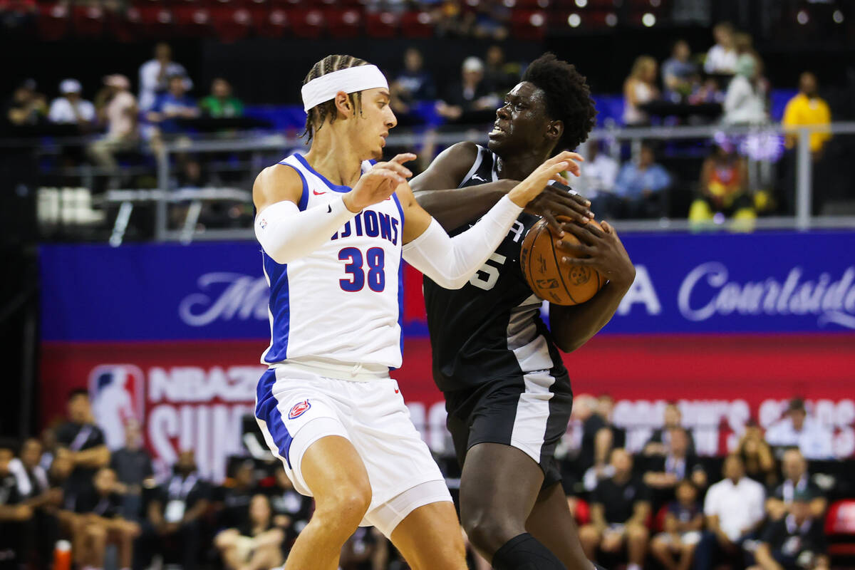 San Antonio Spurs guard/forward Sidy Cissoko (25) moves the ball past Detroit Pistons forward W ...