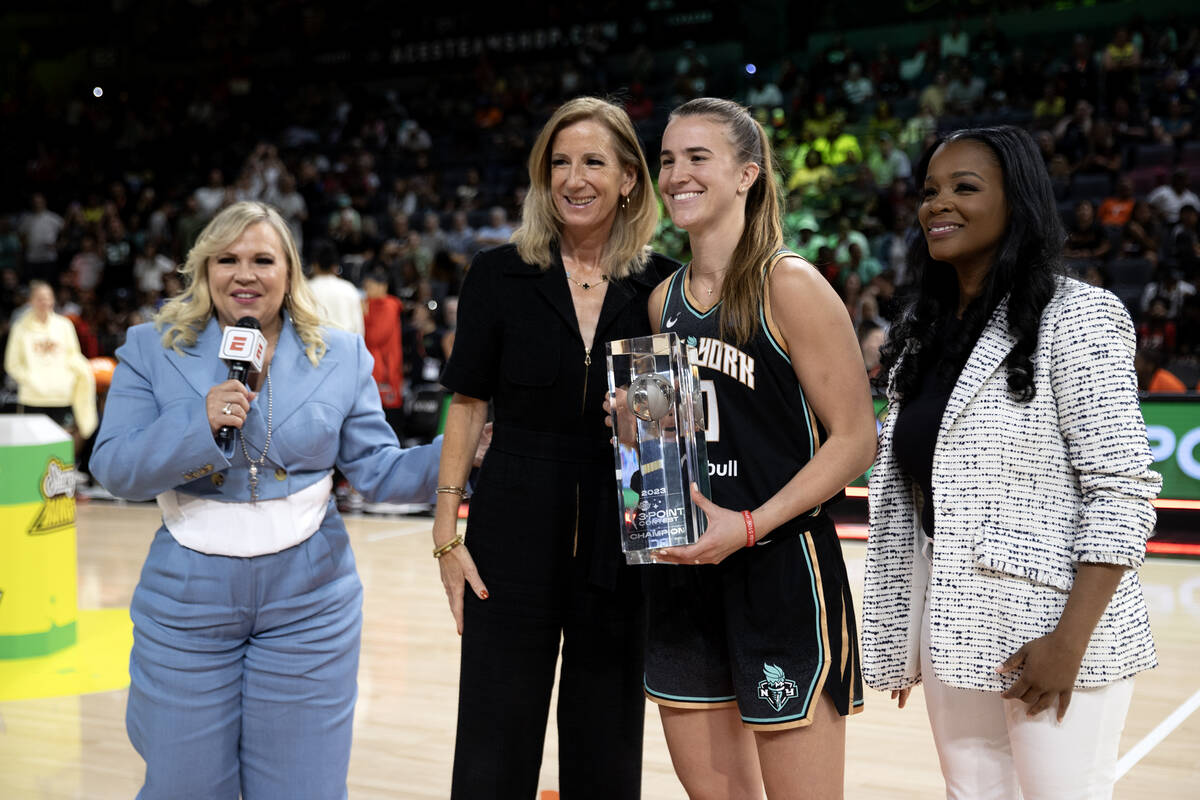 New York Liberty guard Sabrina Ionescu poses with WNBA commissioner Cathy Englebert after winni ...