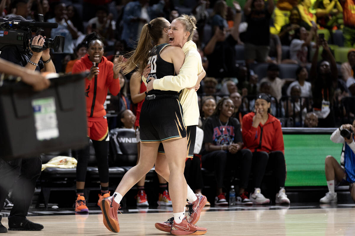 New York Liberty guard Sabrina Ionescu hugs her teammate Courtney Vandersloot after competing i ...