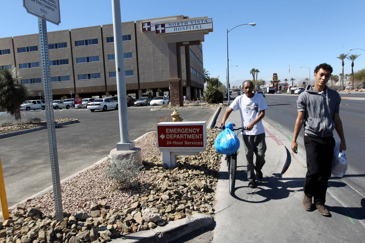 Carlos Sanchez, 61, left, and his son, Jacob Edward Delgado, 23, walk to a bus stop after ...