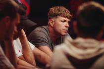 Adam Walton intently watches a competitor at his table during the World Series of Poker $10,000 ...