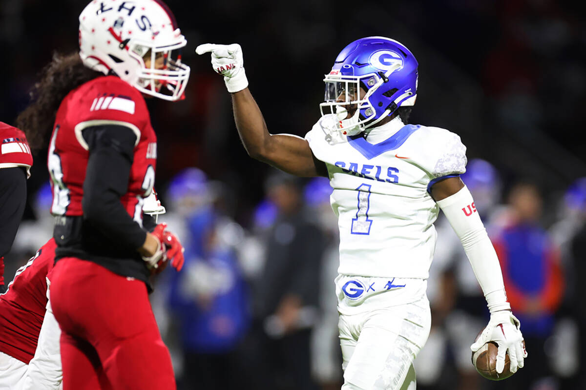 Bishop Gorman's Zachariah Branch (1) gestures first down during the first half of the football ...