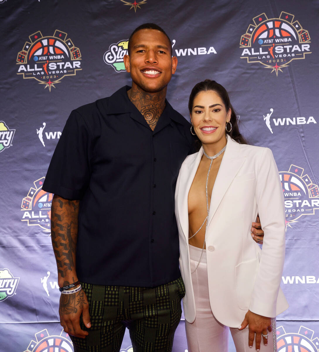 Kelsey Plum of Las Vegas Aces poses for a photo with New York Giants’ Darren Waller on t ...