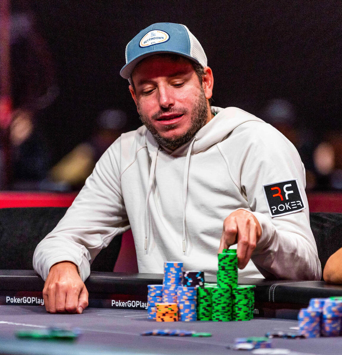 Daniel Weinman stacks more winning chips during Day 7 at the World Series of Poker Main Event i ...