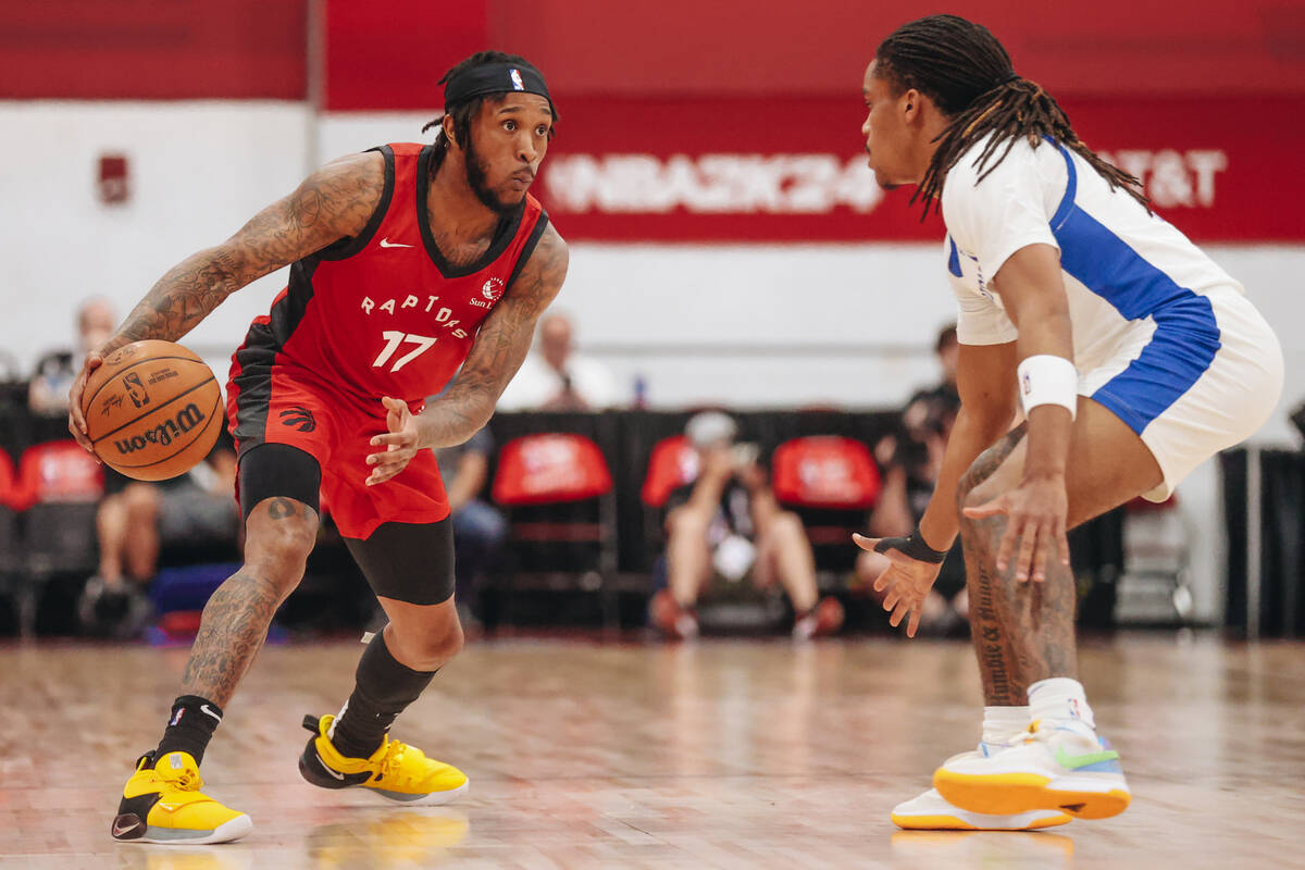 Toronto Raptors guard Ahmad Caver (17) dribbles the ball as Golden State Warriors guard Yuri Co ...