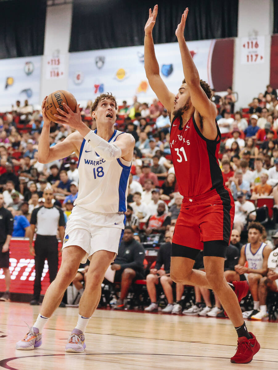 Golden State Warriors forward Michael Jantunen (18) attempts to make a basket while Toronto Rap ...