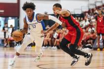 Golden State Warriors guard Kendrick Davis (37) drives the ball past Toronto Raptors guard Marq ...