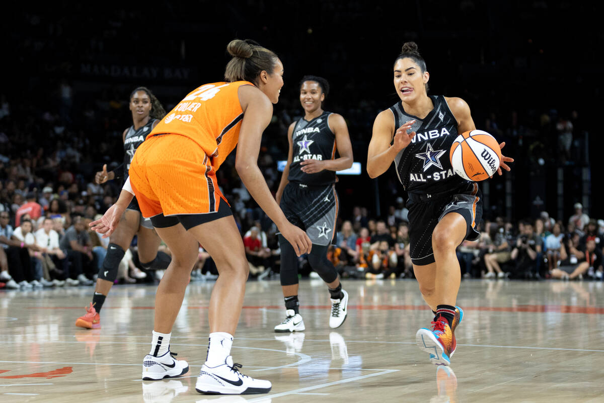 Las Vegas Aces’ Kelsey Plum, of Team Wilson, drives toward Minnesota Lynx's Napheesa Col ...