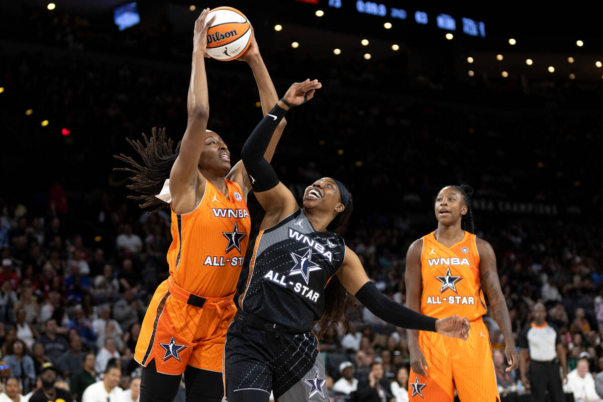 Los Angeles Sparks' Nneka Ogwumike, of Team Stewart, left, keeps the ball away from Minnesota L ...