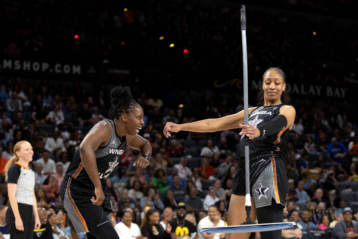 Las Vegas Aces' Chelsea Gray, left, and Aces' A'ja Wilson, both of Team Wilson, dance after Wil ...