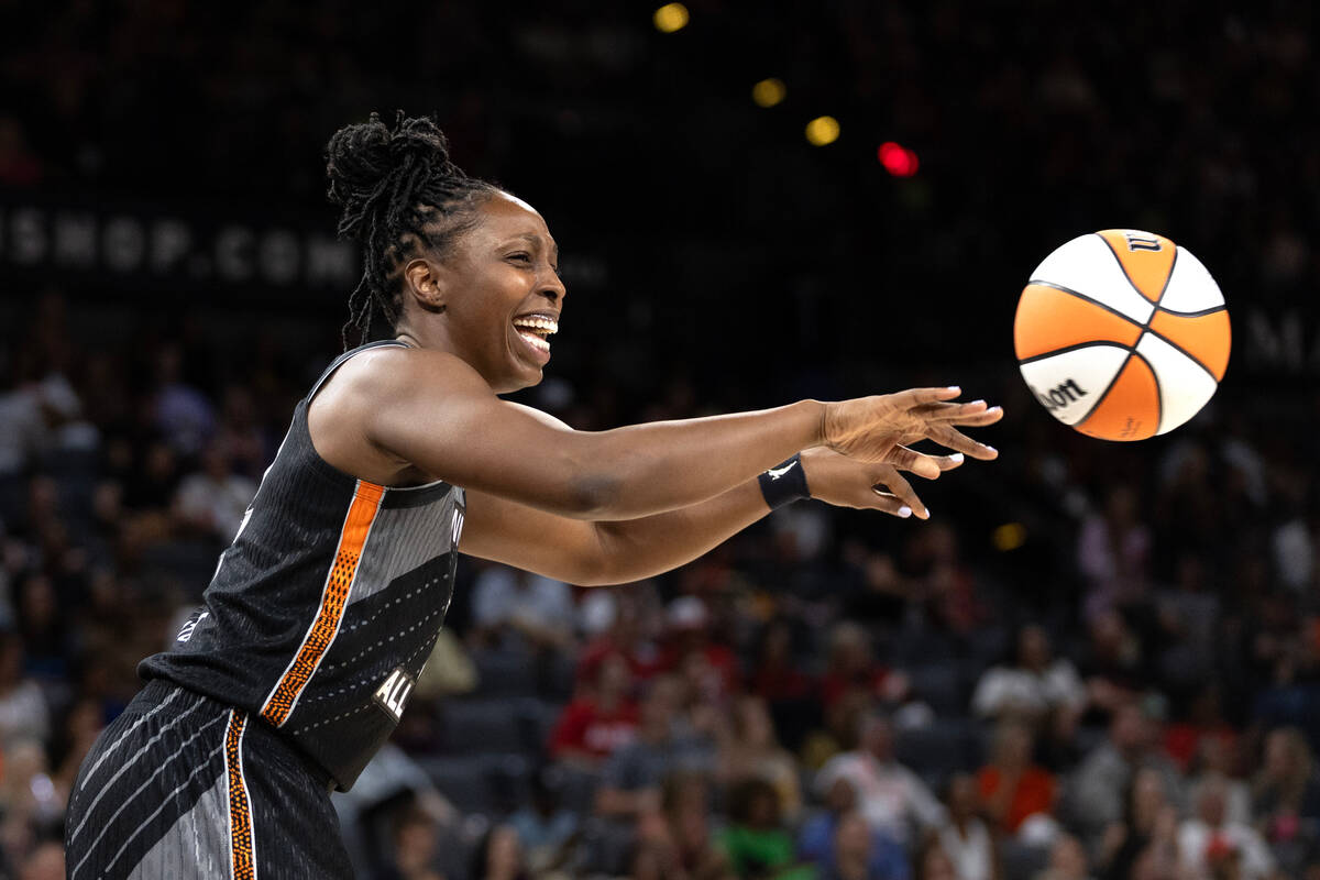 Las Vegas Aces' Chelsea Gray, of Team Wilson, laughs while passing during the second half of a ...