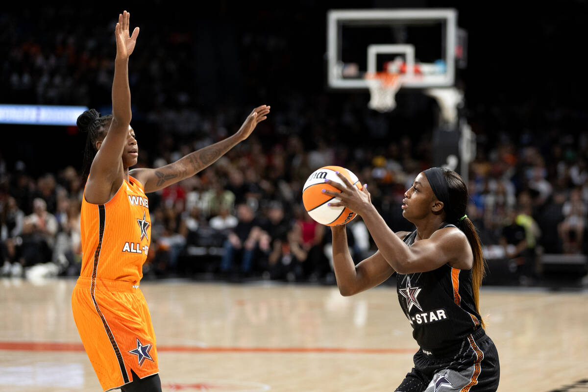 The Las Vegas Aces' Jackie Young, of Team Wilson, shoots against the Seattle Storm’s Jew ...